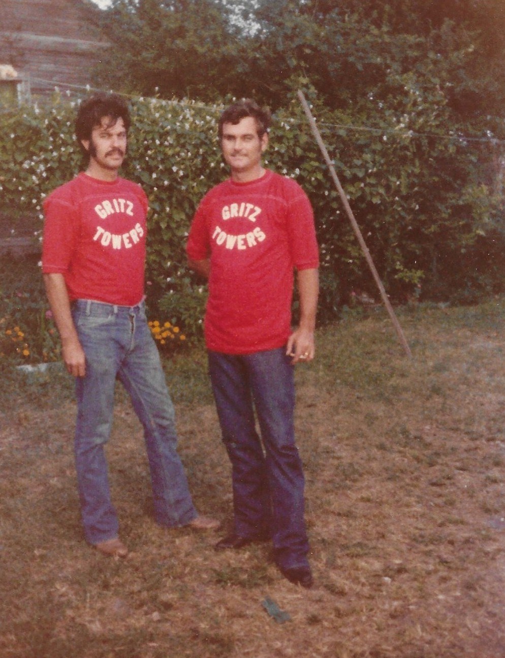 Curtis Gruetzmacher, at left, and another crew member in original red Gritz Towers shirts