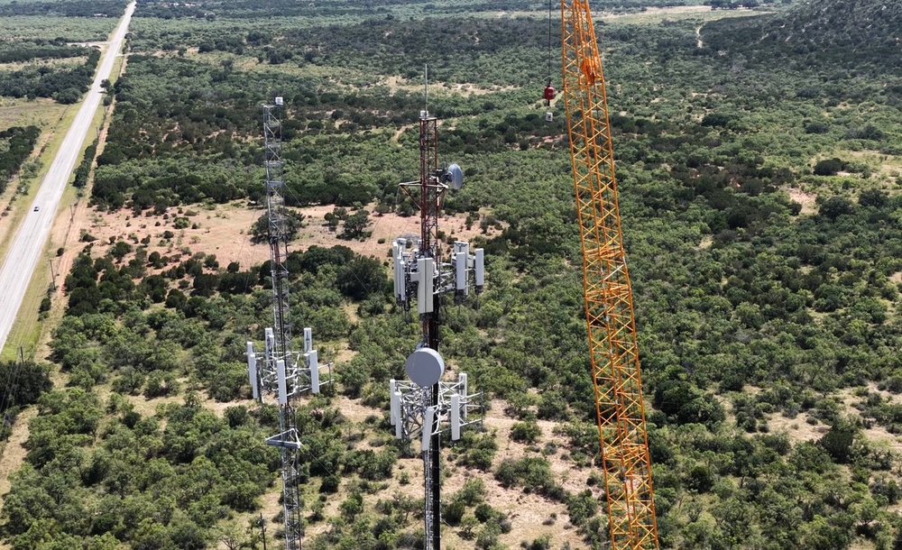 Aerial view of a tower site with a crane