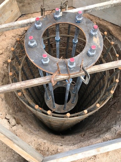 Engineered tower foundation with anchor bolts and rebar cage
