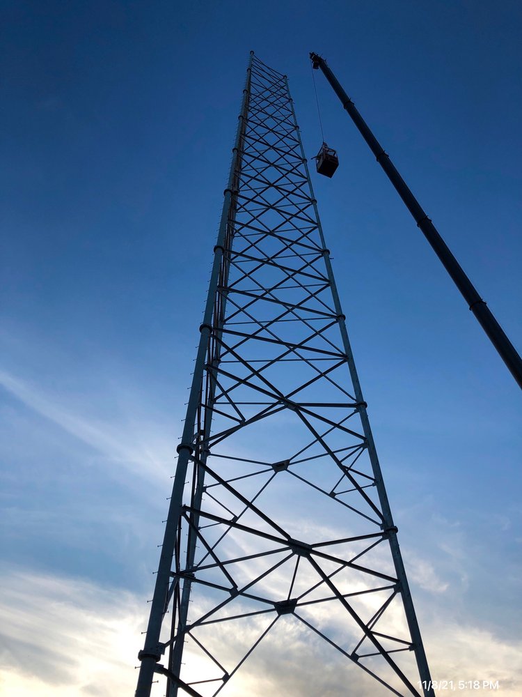New self-support communication tower against a clear sky